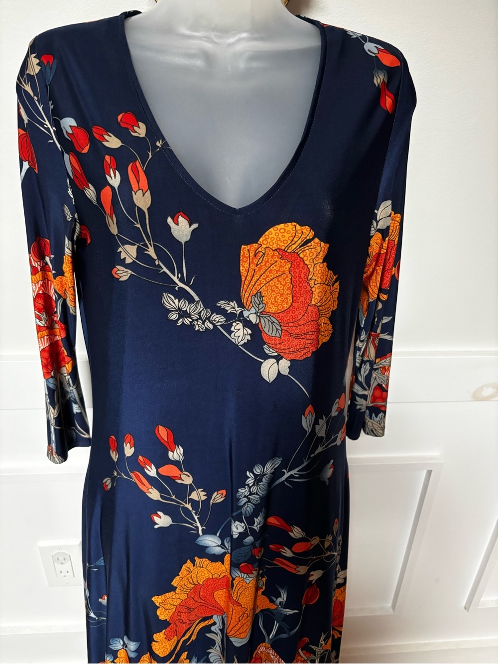 navy blue Last Tango dress features a smooth, stretch knit material adorned with